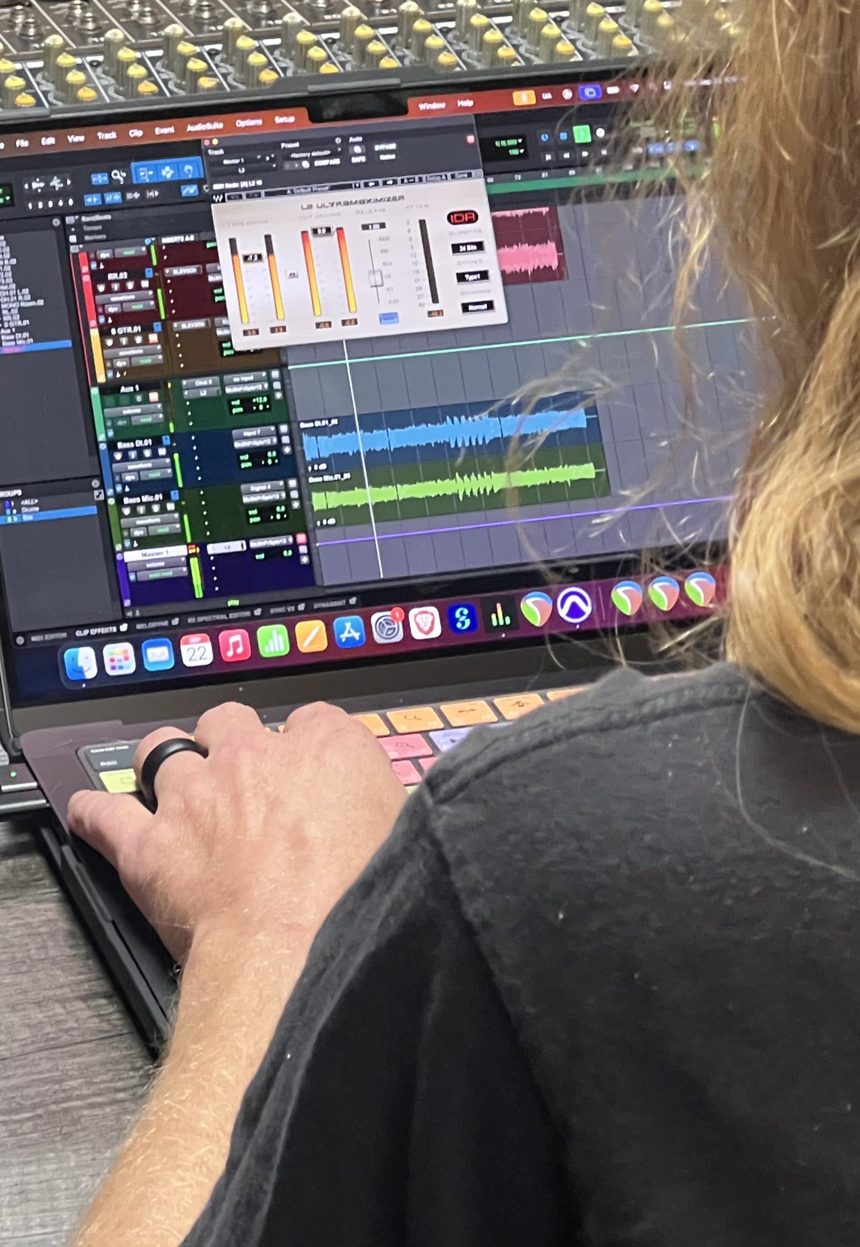 Editing an audio recording on a laptop in Ovation's recording studio.