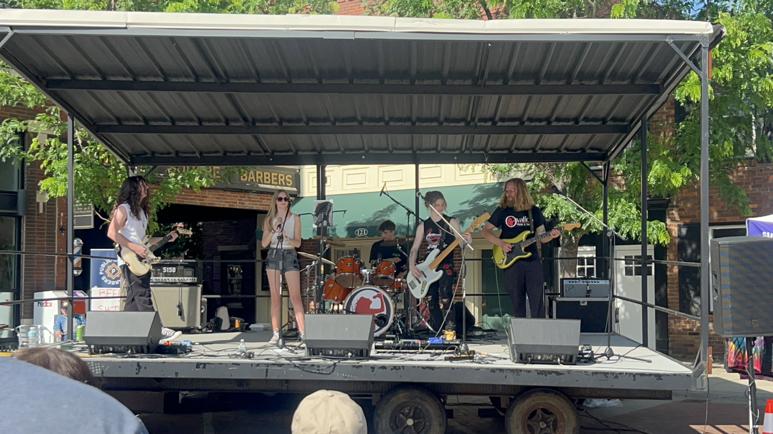 Ovation RockShop band performing on an outdoor stage in downtown Gallatin, TN.