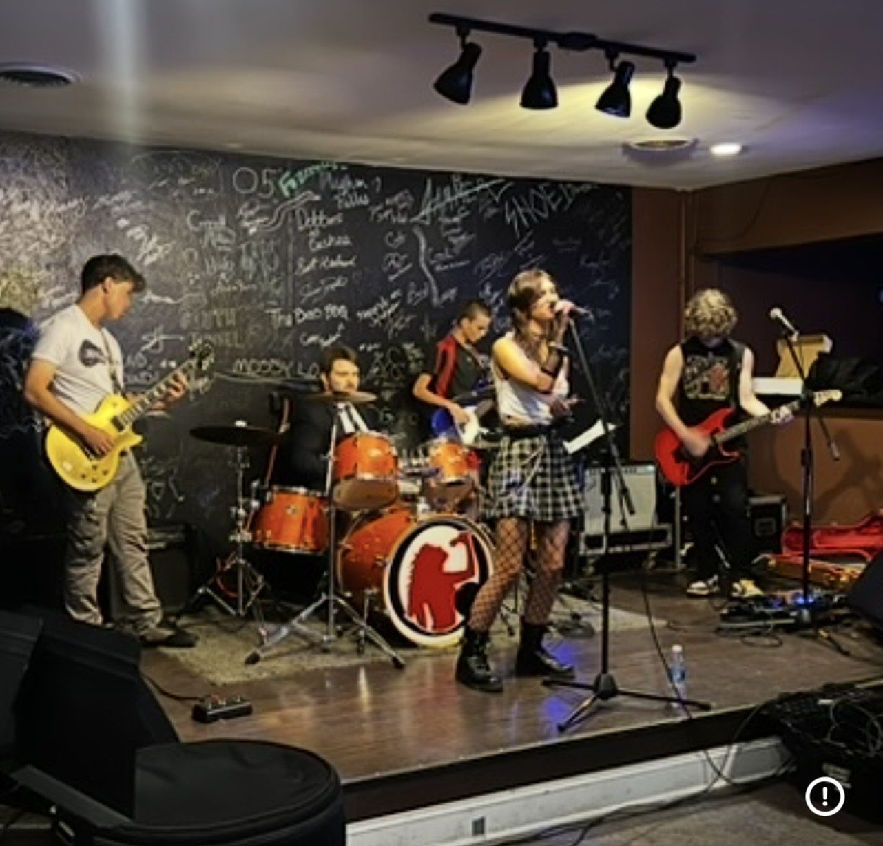 Ovation RockShop band rehearsing with guitar, drums, and vocals.