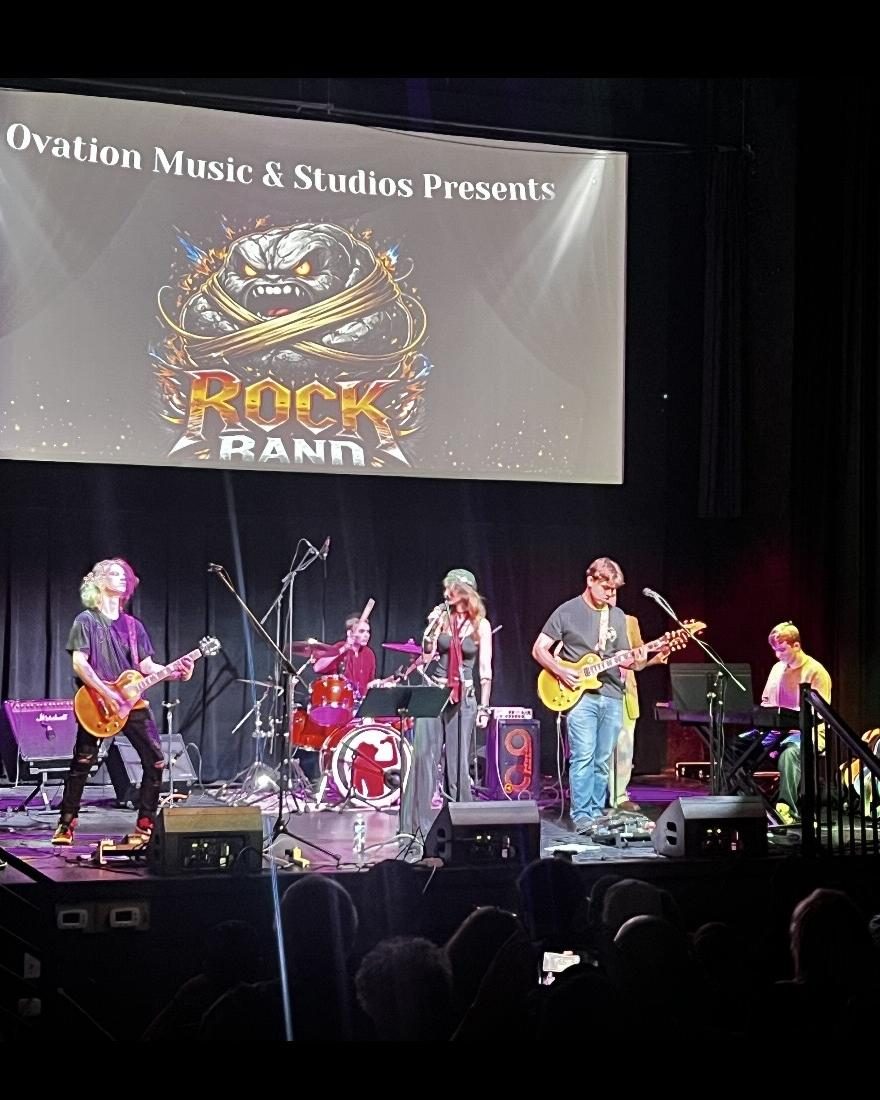 Ovation RockShop students performing live on stage.